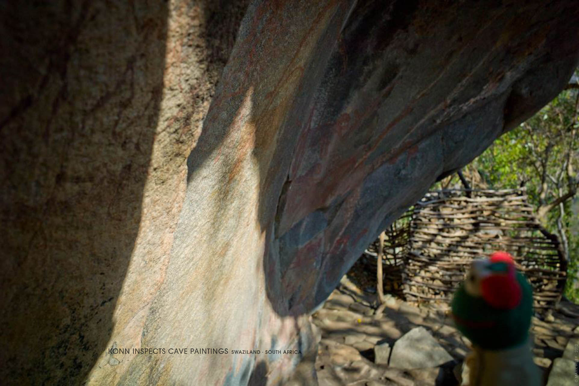 Mark Hiley's KONN THE FROG inspects cave paintings, Swaziland, South Africa